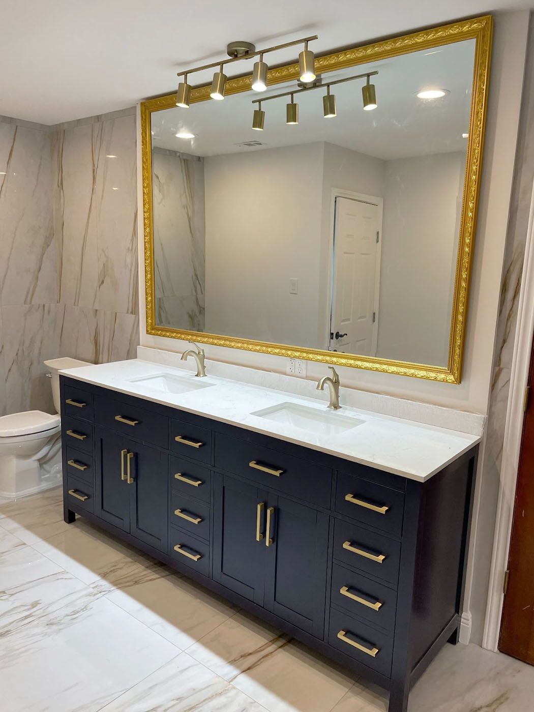 A straight-on shot of a new renovated tile bathroom wall.