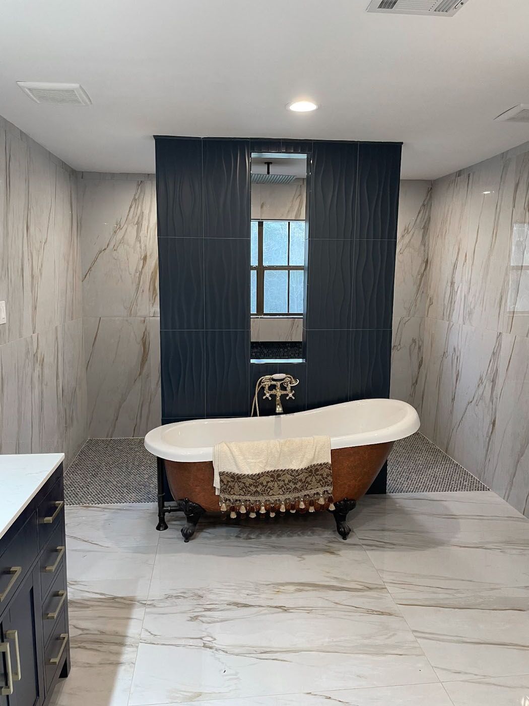 White tile newly installed in a shower by Footprints Bath and Tile Lawrenceville / Sugar Hill.